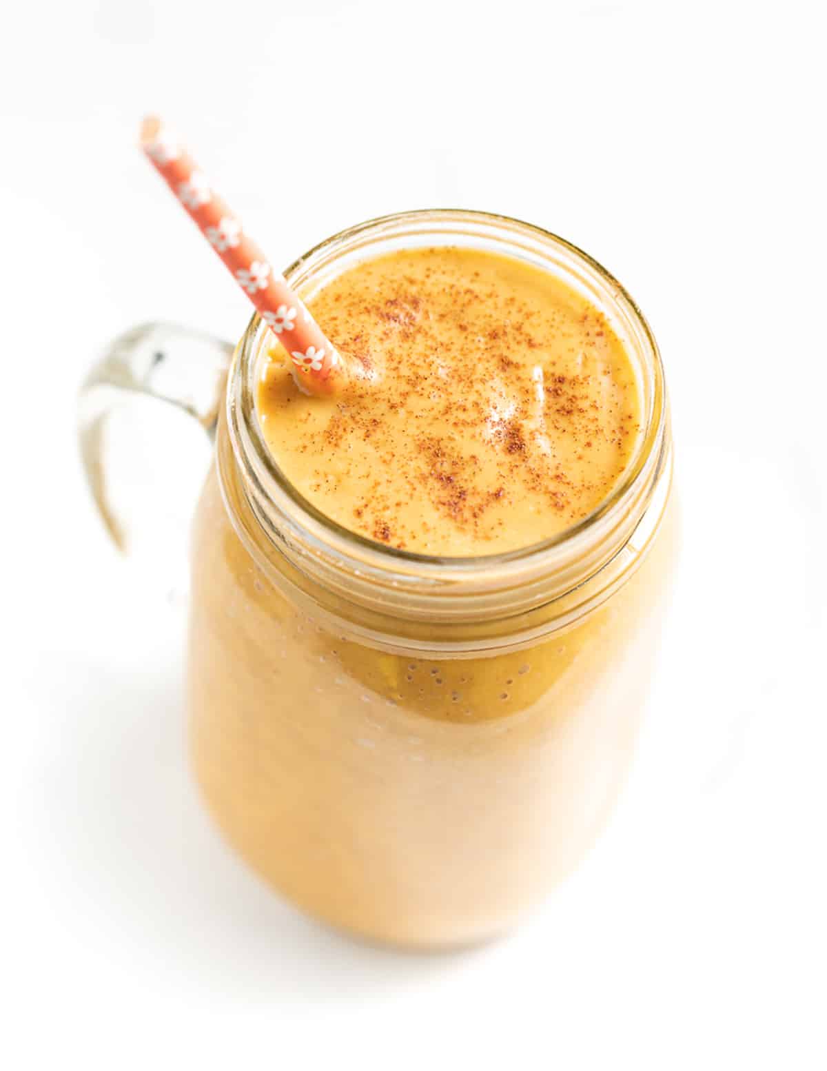 a sweet potato smoothie with cinnamon on top.