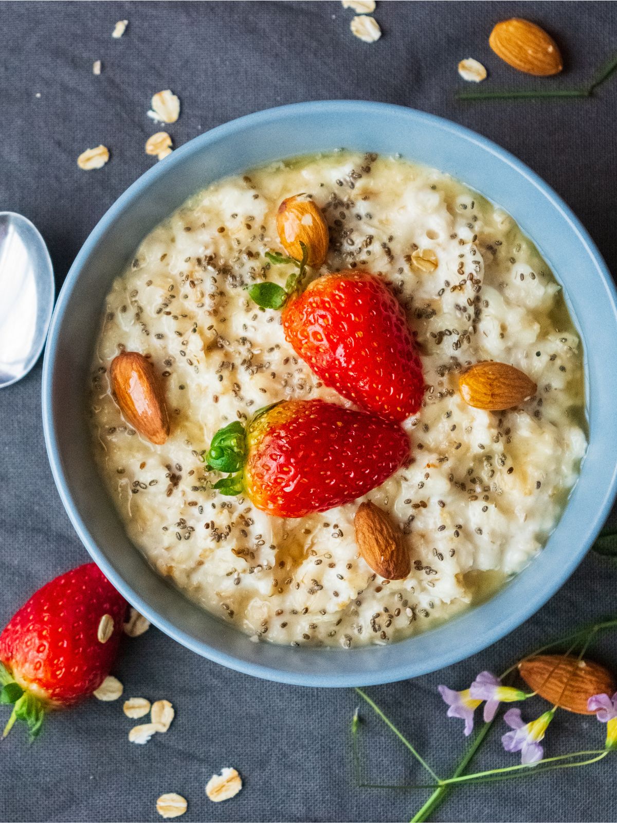 a bowl of steel cut oats and strawberries