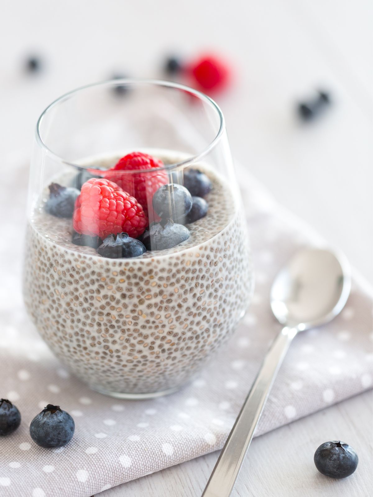 a cup of chia pudding with berries.