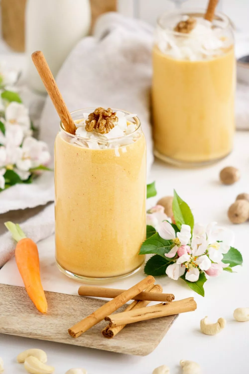 carrot cake smoothies with cinnamon sticks.