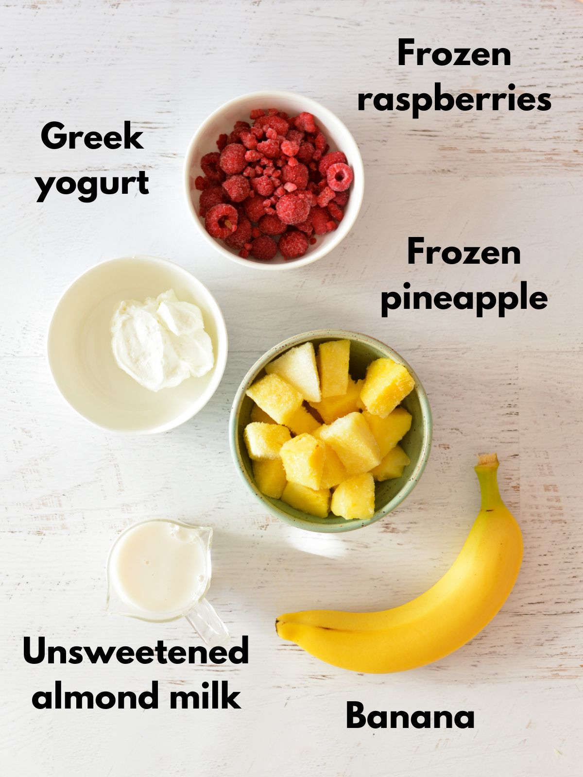 frozen raspberries, frozen pineapple, yogurt, almond milk, banana