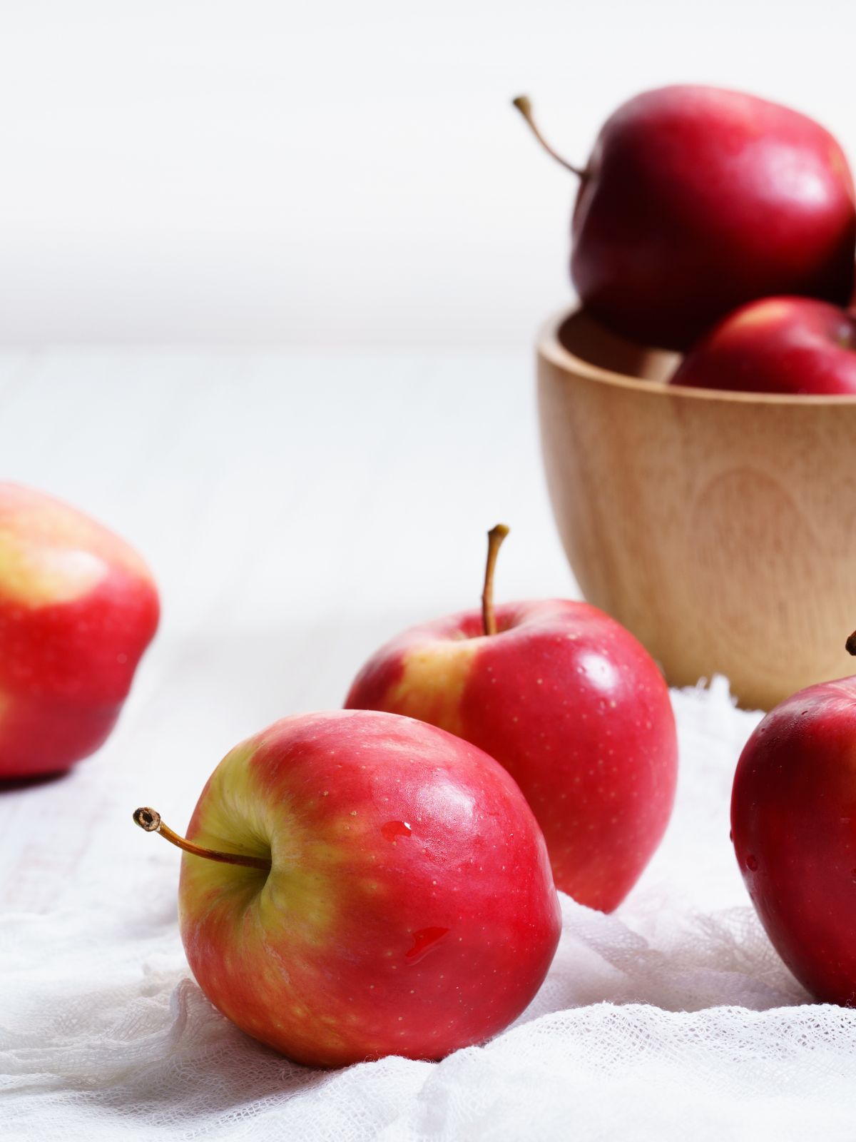 apples near a bucket of apples.