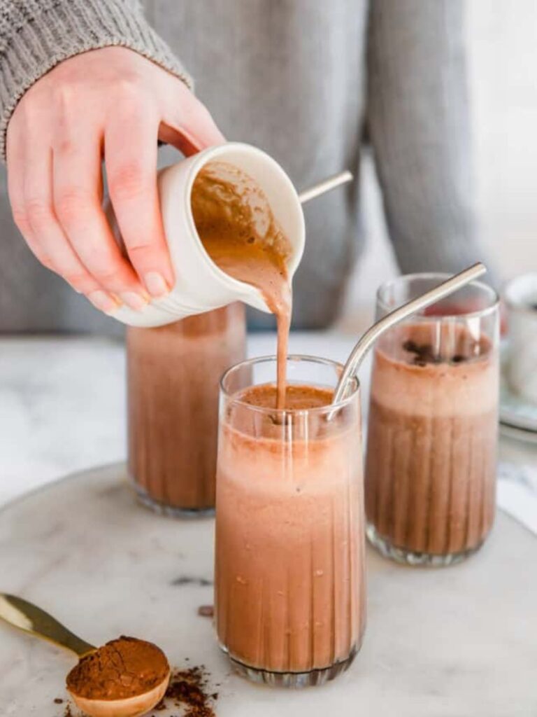 https://sipsipsmoothie.com/wp-content/uploads/2023/02/pouring-a-coffee-smoothie-768x1024.jpg