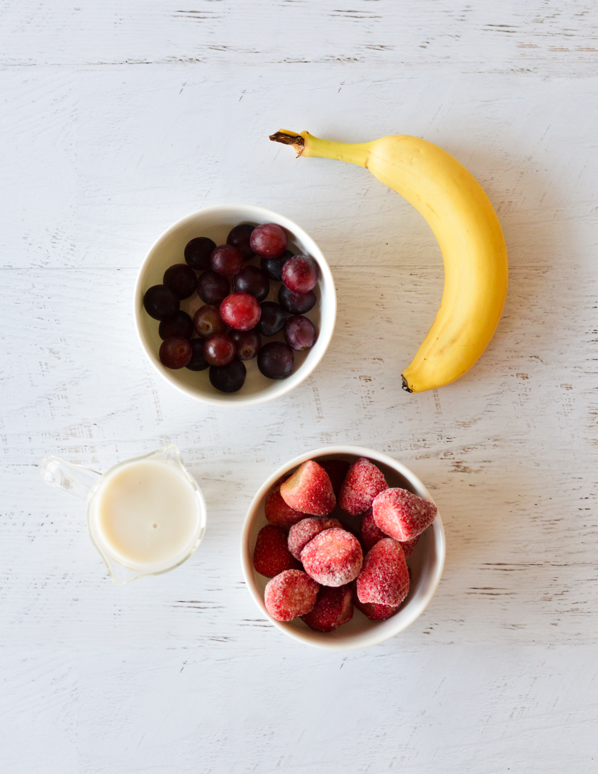 banana, red grapes, strawberries, and almond milk.