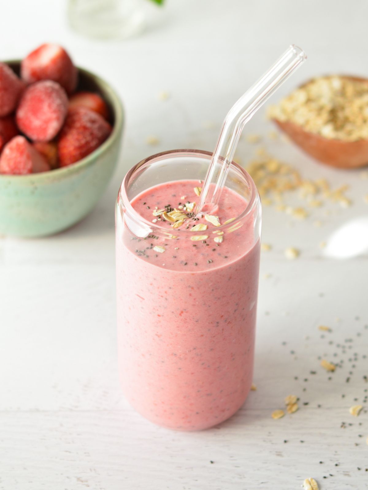 raspberry smoothie with oats and chia seeds on top.