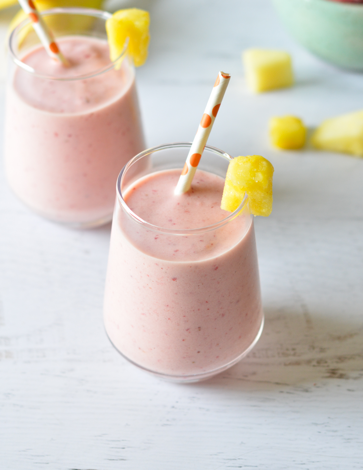 strawberry smoothies with pineapple on top.