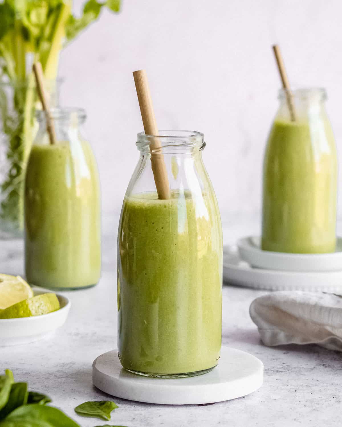green smoothies in glass jars.