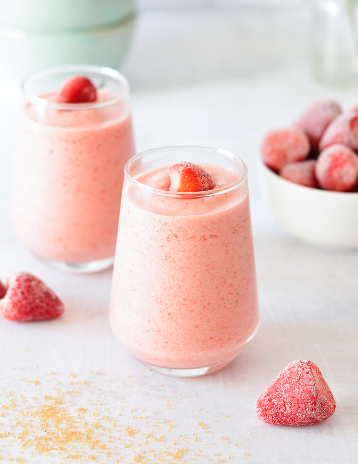 strawberry smoothies with strawberries on top.