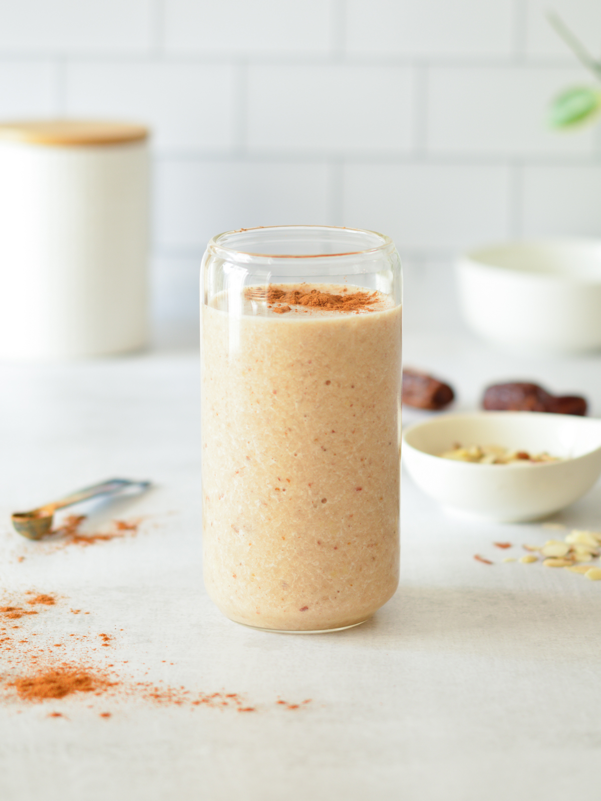 cinnamon banana smoothie with cinnamon on top.