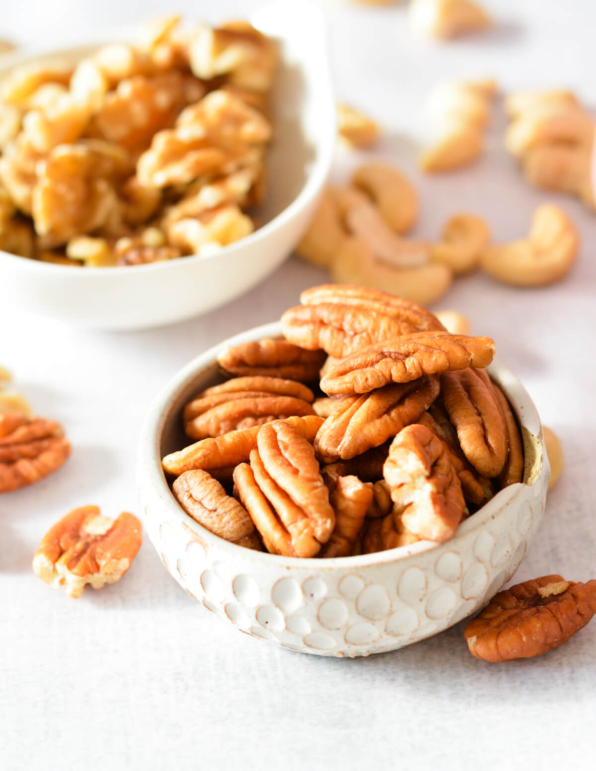 a small bowl of pecans and walnuts.