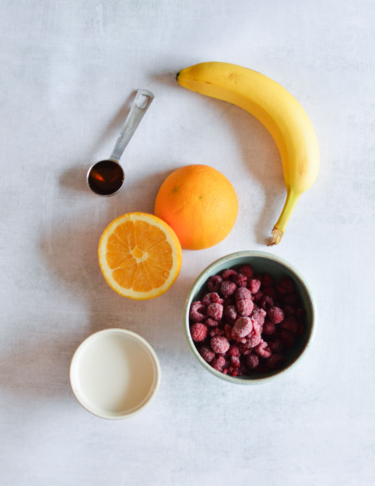 banana, navel orange, maple syrup, frozen raspberries, almond milk.